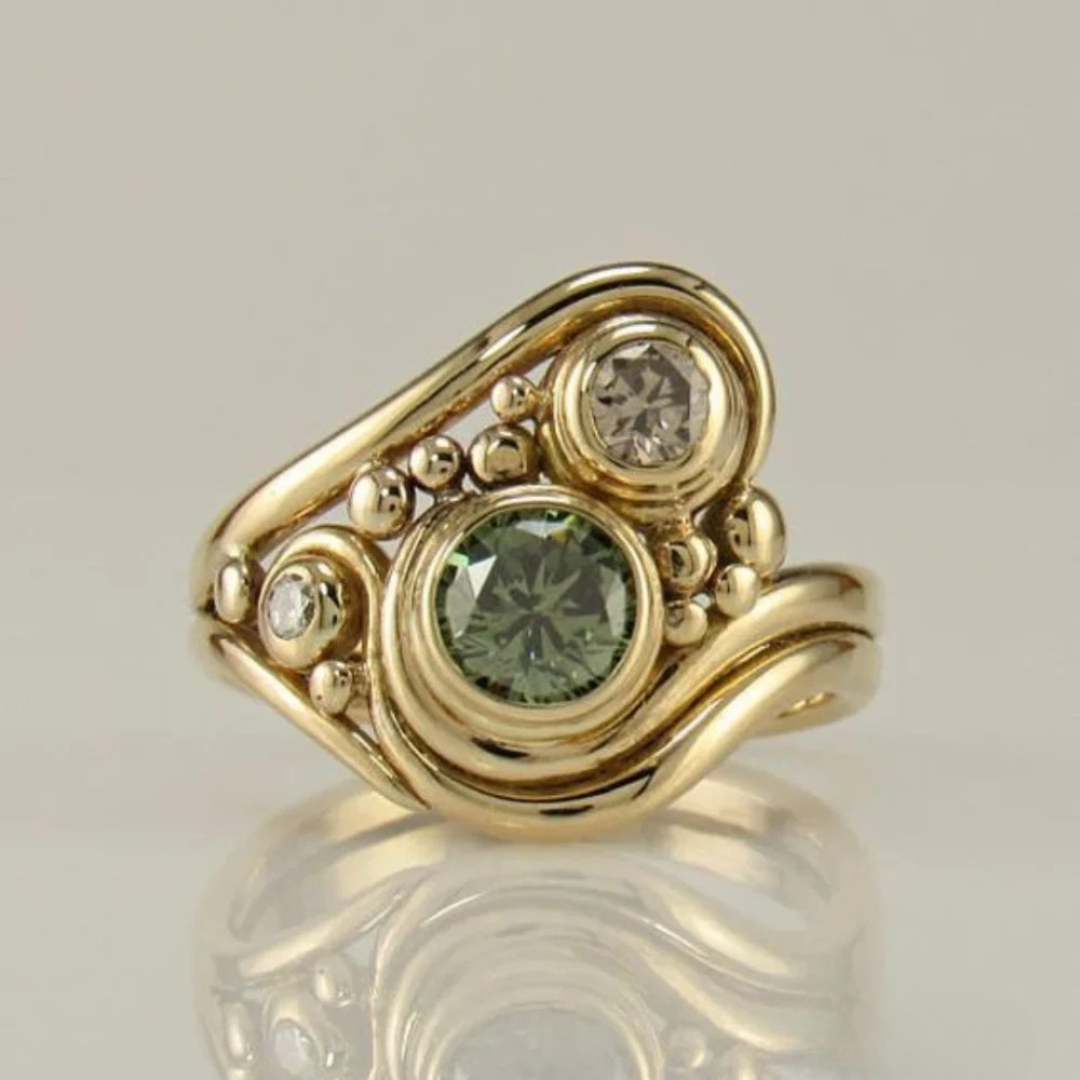 Vintage gold ring with green zirconium